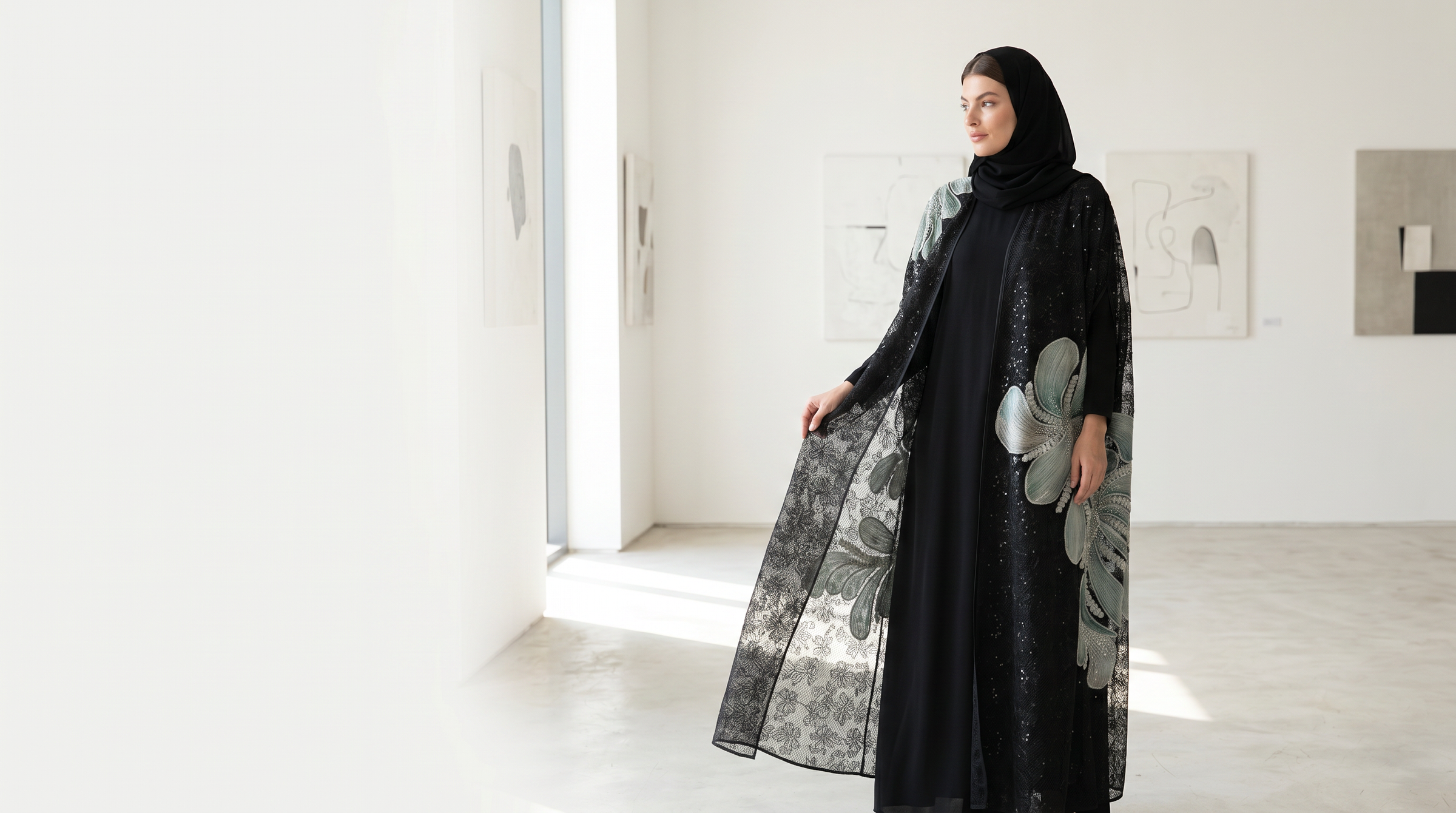 Sui New Releases hero — Sage Rose on Black Dantelle abaya in a bright gallery